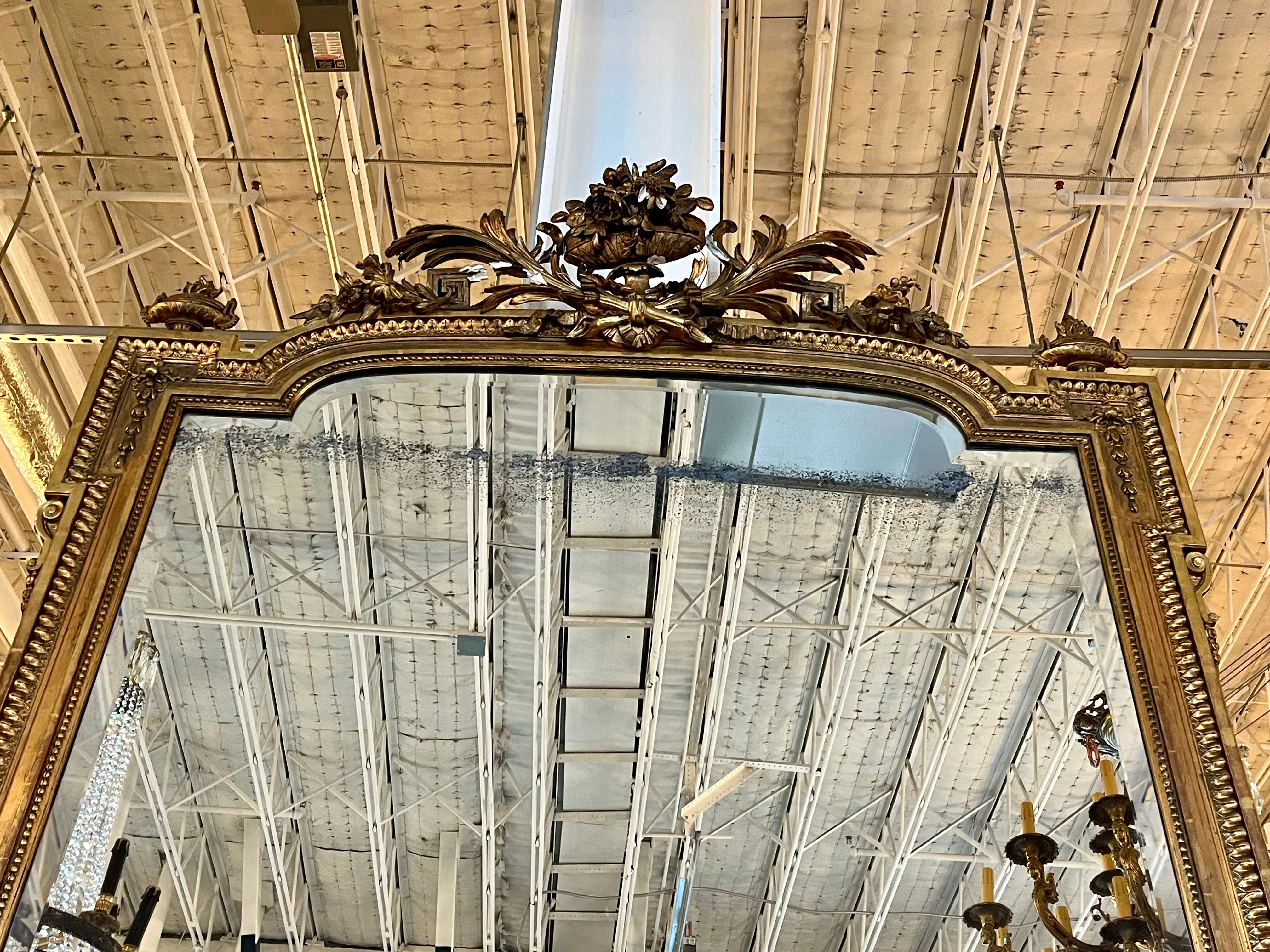 1700s Antique French Ornate Mirror with a Gilded Crest and Beaded Details